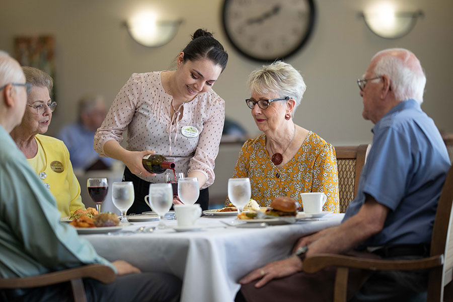 The Oaks at Bartlett | Group of seniors having some wine