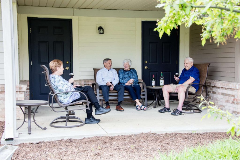 seniors laughing with wine