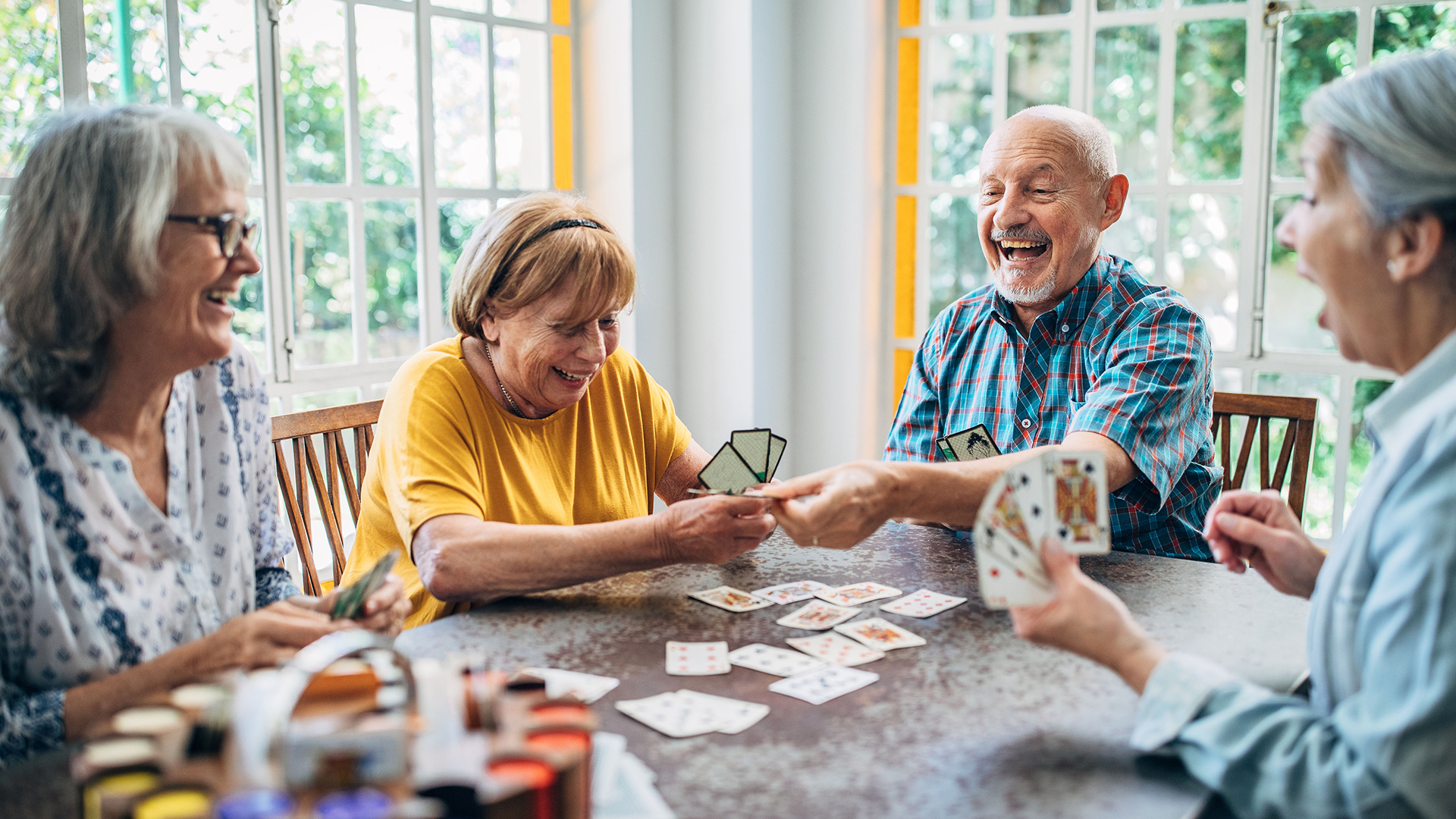 group playing card games after moving to senior living